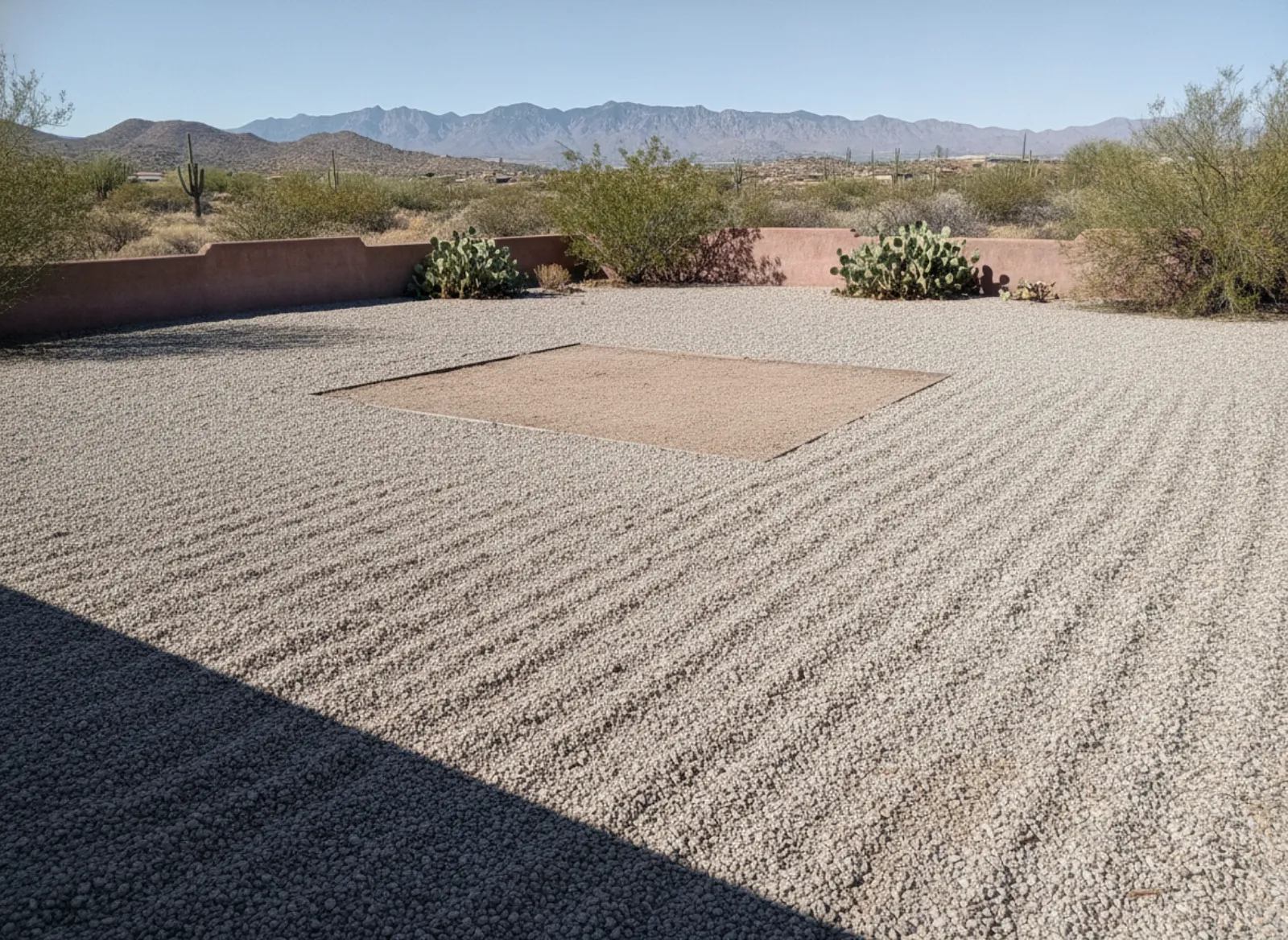 Cleared, raked backyard spot after shed removal in Las Cruces